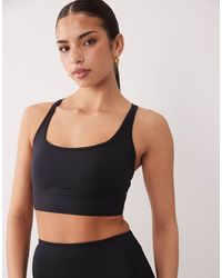 4505 - Strappy Medium Support Sports Bra With Removable Padding - Lyst