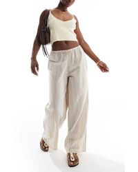 Wednesday's Girl - Pantalon ample en lin à rayures - beige - Lyst