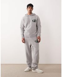 ASOS - Oversized Knitted Cuffed Trackies With Nyc Chest Logo - Lyst