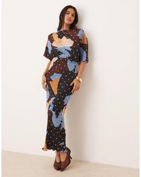 Never Fully Dressed - Tilly Asymmetric Gold Foil Plisse Maxi Dress - Lyst