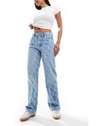 Calvin Klein - Vaqueros Azul Medio Con Estampado Integral De Estilo Años 90 Signature De - Lyst