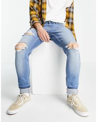 Hollister – supereng geschnittene jeans im used-look - Blau
