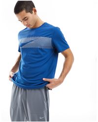 Nike - Camiseta azul con detalles reflectantes flash dri-fit miler - Lyst
