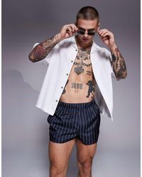 ASOS - Pantaloncini Da Bagno Taglio Molto Corto A Righe Blu E Bianche - Lyst