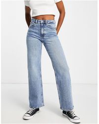 ONLY - Juicy - jeans a vita bassa con fondo ampio lavaggio medio - Lyst