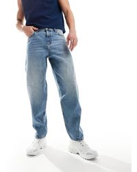 ASOS - Jeans ampi lavaggio chiaro con baffature - Lyst