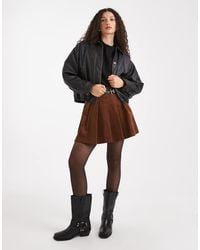 New Look - Corduroy Pleated Buckle Mini Skirt - Lyst