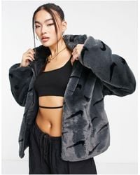 Nike - All Over Swoosh Faux Fur Jacket - Lyst