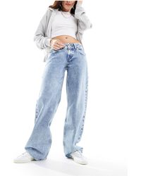Levi's - Jeans ampi lavaggio azzurro con vita super bassa - Lyst