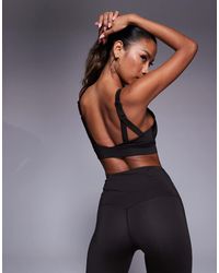 4505 - Icon Active Medium Support Sports Bra With Removable Padding And Adjustable Straps - Lyst