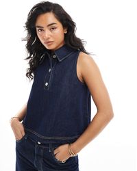 ASOS - Top boutonné sans manches en jean avec col - indigo - Lyst