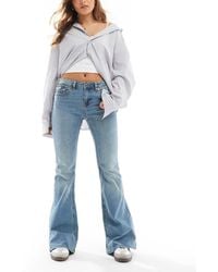 Stradivarius - Low Rise Flare Jean - Lyst