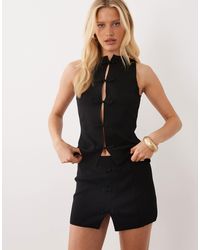Mango - Pekin - mini-jupe d'ensemble avec nœud - Lyst