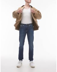 Calvin Klein - Vaqueros De Corte Slim Tapered Con Lavado Medio De Calvin Klein-Azul - Lyst