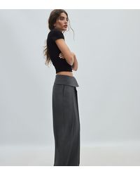 Stradivarius - Petite Wide-leg Trousers With Turned-up Waistband - Lyst