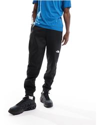 The North Face - Training Reaxion Fleece Trackies - Lyst