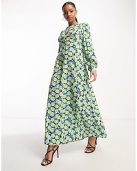 Vero Moda - Vestido largo verde con estampado floral y abertura aware - Lyst