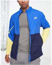 New Balance - Impact run - giacca color block con zip blu e gialla - Lyst