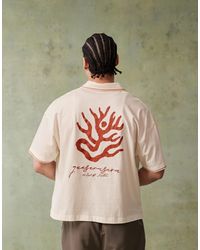 ASOS - Polo coupe carrée à manches courtes avec broderie sur la poitrine et motifs au dos - cassé - Lyst