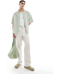 ASOS - Pantalones color holgados con cintura elástica - Lyst