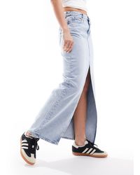 Calvin Klein - Gonna lunga di jeans lavaggio chiaro - Lyst