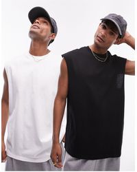 TOPMAN - Confezione da 2 t-shirt oversize senza maniche color bianco e nero - Lyst