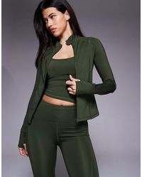 4505 - Chaqueta Deportiva Moldeador De Manga Larga Con Cremallera Y Bolsillos Con Cremallera Icon De -Verde - Lyst