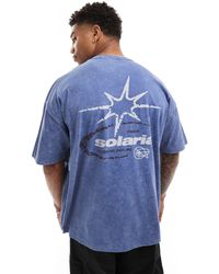 ASOS - Camiseta azul lavado extragrande con estampado cósmico en la espalda - Lyst