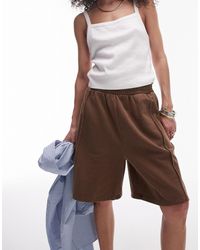 TOPSHOP - Pantalones cortos alargados marrón con lavado ácido - Lyst