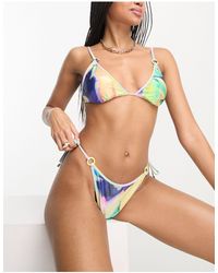 River Island - Top bikini a triangolo con stampa floreale tropicale - Lyst