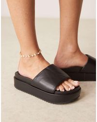 ASOS - Mules Negros Con Planta Moldeada Y Plataforma Plana Festival De - Lyst
