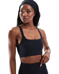 4505 - Icon Medium Support Square Neck Sports Bra - Lyst
