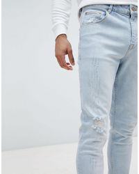 ASOS - Asos Tapered Jeans In Light Wash Blue With Abrasions - Lyst