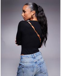 Kaiia - Exclusivité - - body asymétrique en maille avec manches longues et boutons au dos - Lyst