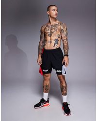 4505 - Pantalones Cortos De 8 Cm Negros Para Correr Con Bolsillo Trasero Para Teléfono De Tejido De Secado Rápido Icon De - Lyst
