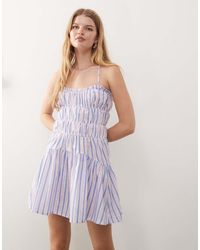 Reclaimed Vintage - Mini Sun Dress With Ruching And Cross Back Detail - Lyst