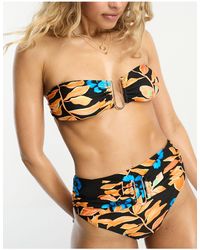 River Island - Top bikini a fascia nero con stampa tropicale e finiture ad anello - Lyst