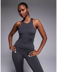 4505 - Icon Active Racer Back Singlet With Inner Bra And Removable Padding - Lyst