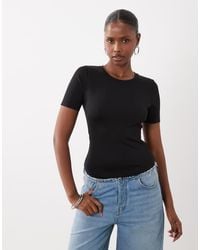 GOOD AMERICAN - Sculpting Tee Bodysuit - Lyst