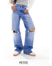 Stradivarius - Petite - jeans a fondo ampio color medio slavato - Lyst
