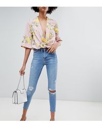 River Island Molly - Distressed Skinny Jeans Met Onafgewerkte Zoom In Mid Wash - Blauw