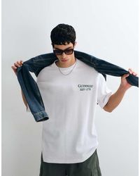 ASOS - Oversized T-Shirt With Guinness Print - Lyst