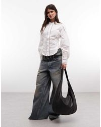 AllSaints - Frances Blouse Met Lange Mouwen, Opstaande Hals En Kant Met Corsetdetail Aan De Zijkant - Lyst