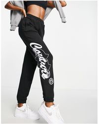The Couture Club Graphic Trackies - Black