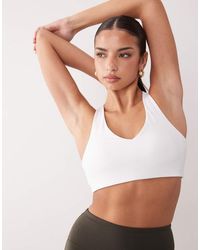 4505 - Active Push Up Medium Support Sports Bra - Lyst