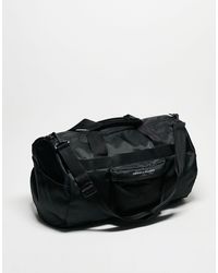 Tommy Hilfiger - Skyline - borsa a sacco nera con logo - Lyst