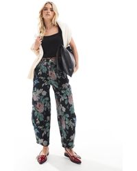 ASOS - Petite - pantalon large à imprimé fleurs - Lyst