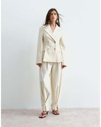 ARRANGE - Tapered Fold Detail Tailored Pants - Lyst