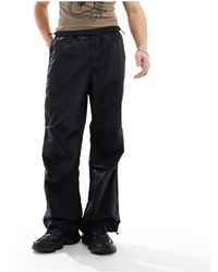 ASOS - Pantalones s holgados con bajo ancho - Lyst