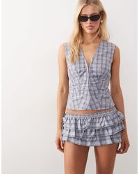 Mango - Cumin - mini-short d'ensemble à carreaux et volants - Lyst